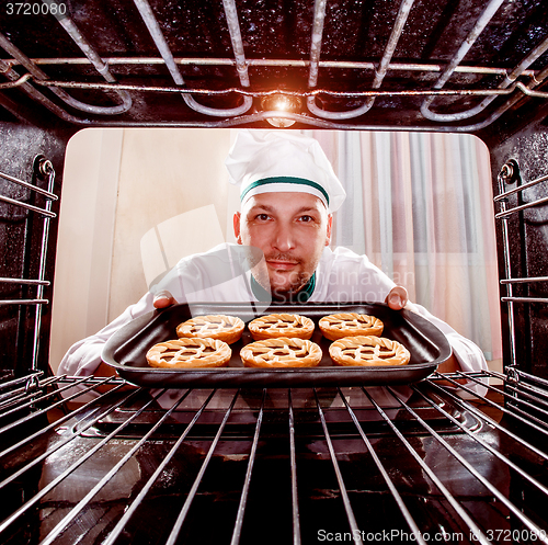 Image of Chef cooking in the oven.