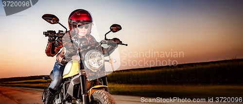 Image of Biker girl on a motorcycle