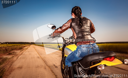 Image of Biker girl on a motorcycle
