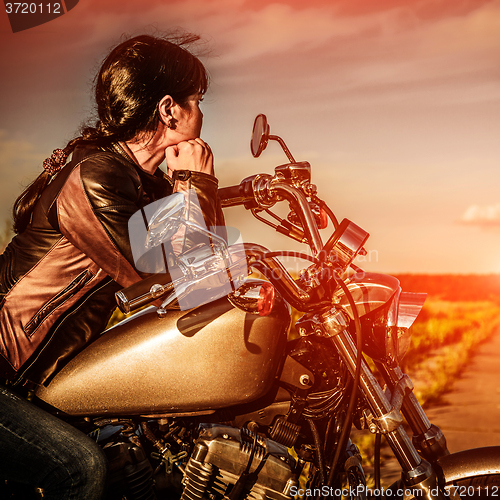 Image of Biker girl on a motorcycle