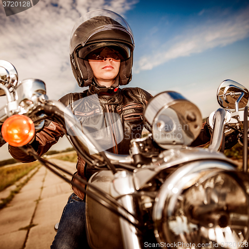 Image of Biker girl on a motorcycle