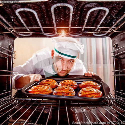 Image of Chef cooking in the oven.