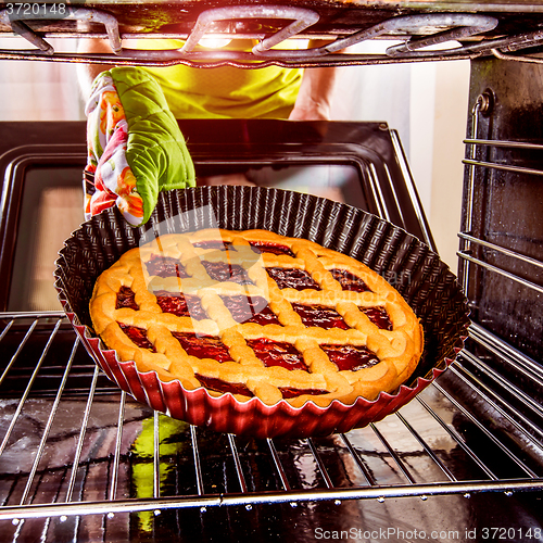 Image of Cooking in the oven at home.