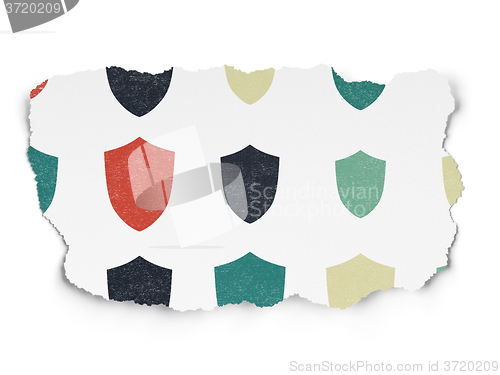 Image of Protection concept: Shield icons on Torn Paper background