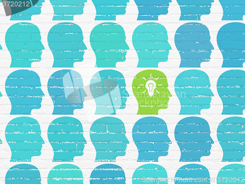 Image of Finance concept: head with light bulb icon on wall background
