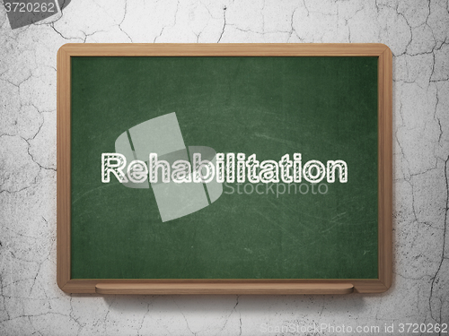 Image of Medicine concept: Rehabilitation on chalkboard background