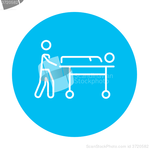 Image of Man pushing stretchers line icon.