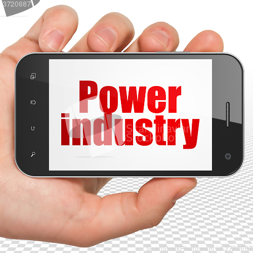 Image of Industry concept: Hand Holding Smartphone with Power Industry on display