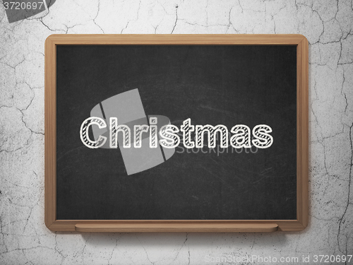 Image of Holiday concept: Christmas on chalkboard background