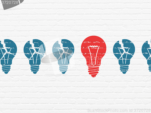 Image of Business concept: light bulb icon on wall background