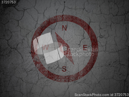 Image of Travel concept: Compass on grunge wall background