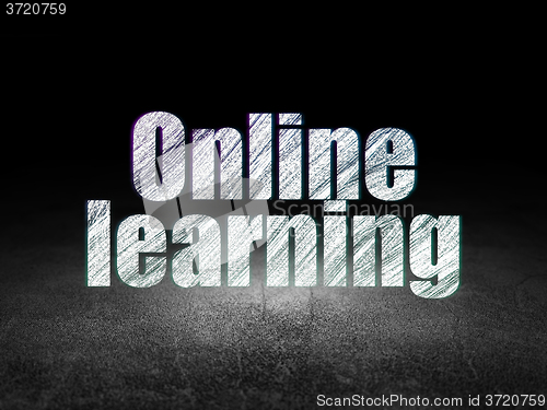 Image of Studying concept: Online Learning in grunge dark room