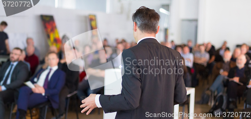 Image of Speaker at Business Conference and Presentation.