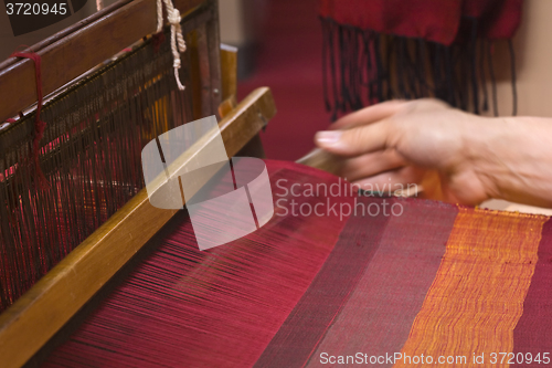 Image of Old Loom weaving