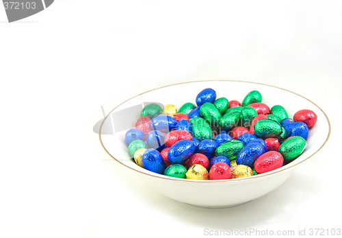 Image of white bowl of easter eggs isolated on white background