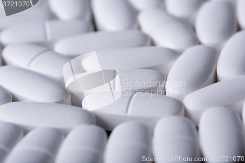 Image of White pills on the black