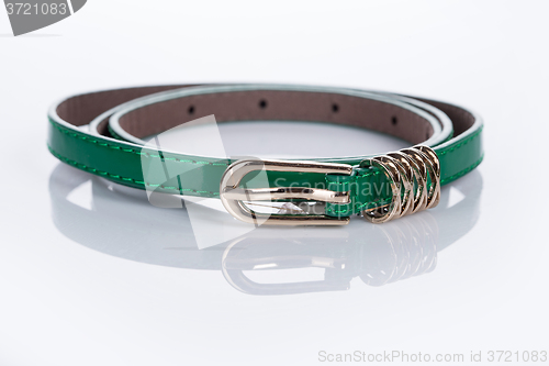 Image of thin green female belt buckle with fine