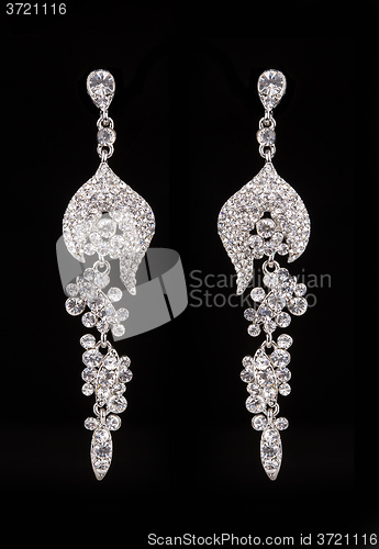 Image of earrings with jewels on the black