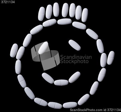 Image of face of white oblong tablets 