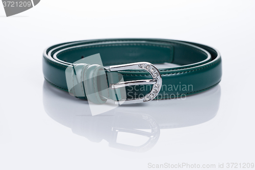 Image of thin green female belt buckle with fine