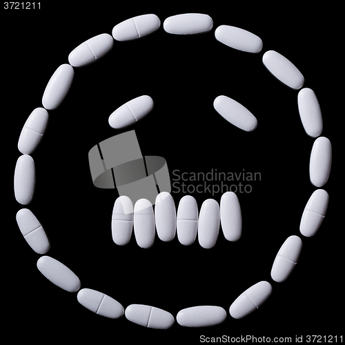 Image of face of white oblong tablets 