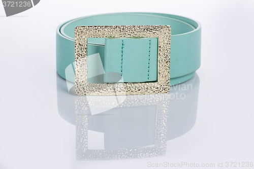 Image of thin green female belt buckle with fine