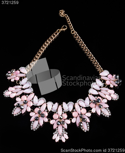Image of luxury pink necklace on black stand
