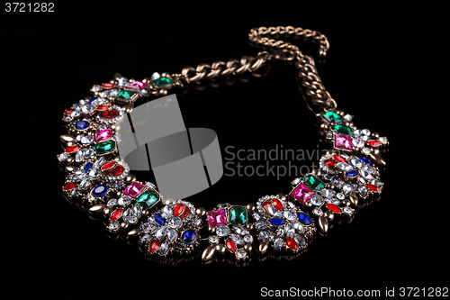 Image of luxury red necklace on black stand