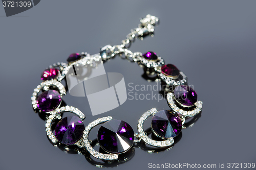 Image of beautiful bracelet on gray background. 