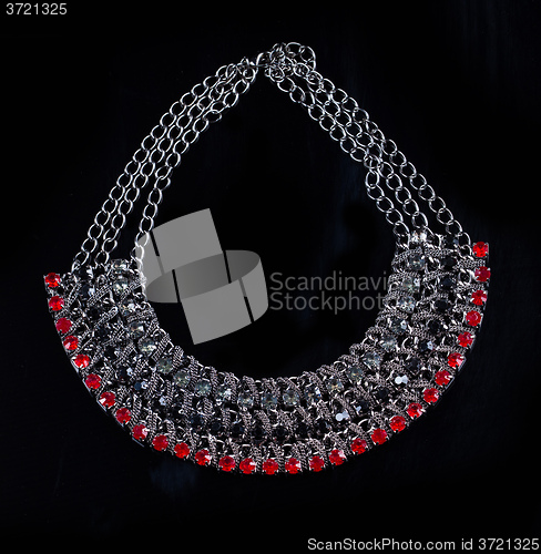 Image of luxury red necklace on black stand