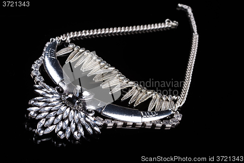 Image of metallic necklace in the form of feathers