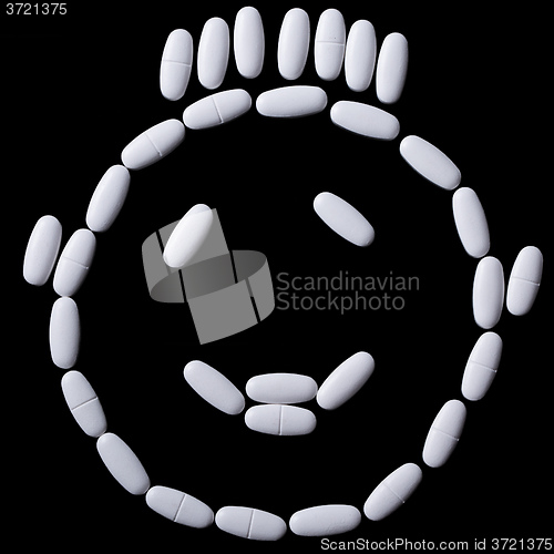 Image of face of white oblong tablets 