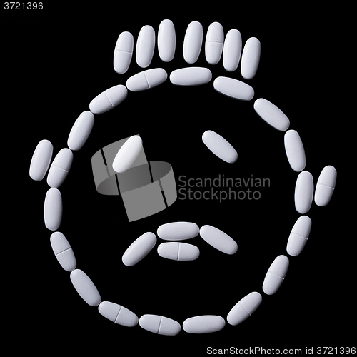 Image of face of white oblong tablets 