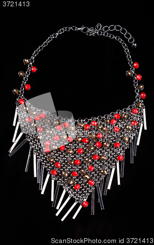 Image of luxury red necklace on black stand