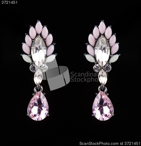 Image of earrings with jewels on the black