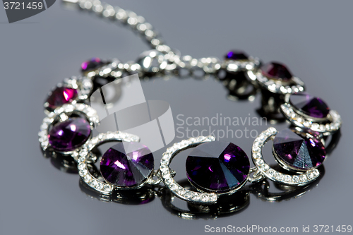 Image of beautiful bracelet on gray background. 