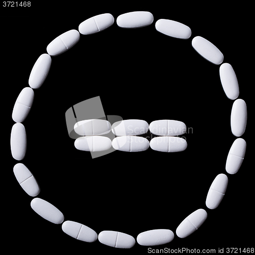 Image of stop sign of white oblong tablets 