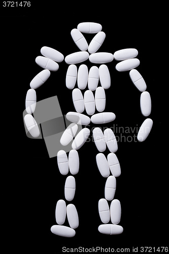 Image of White pills on the black