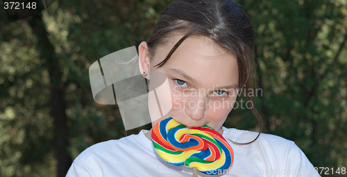 Image of teenager with lollipop