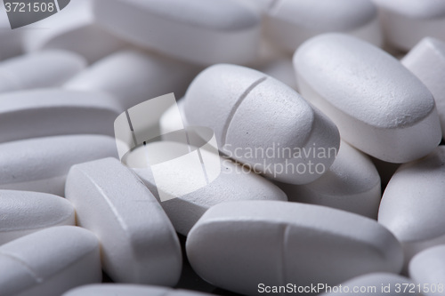 Image of White pills on the black