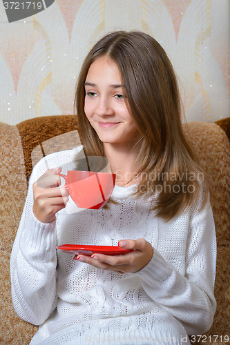 Image of Girl drinks tea