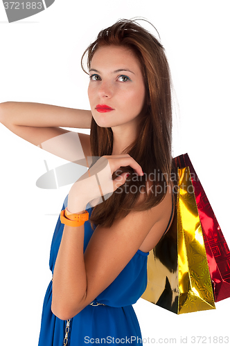 Image of Attractive woman with freckles holding bags
