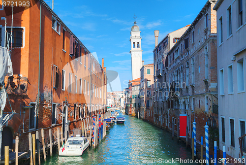 Image of Narrow canal with bridge in Venice