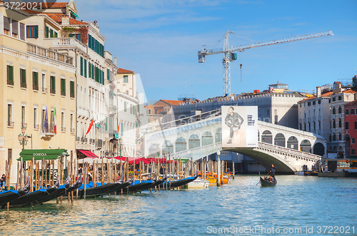 Image of Gondola with tourists in Venice, Italy