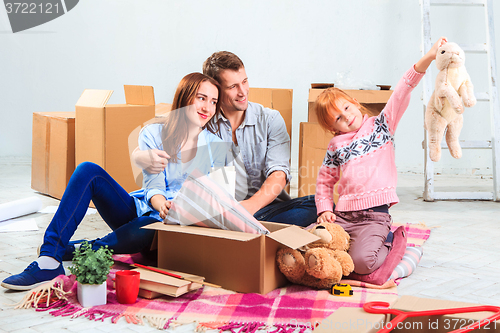 Image of The happy family  during repair and relocation