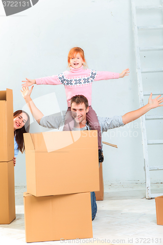 Image of The happy family  during repair and relocation