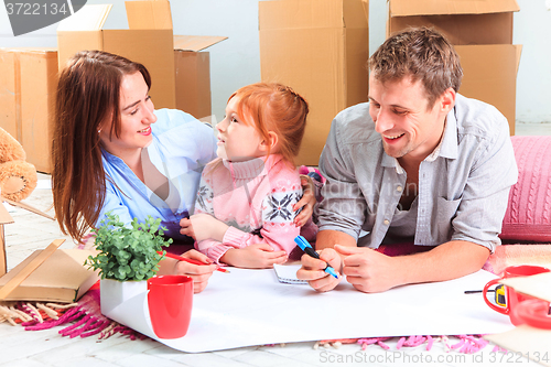 Image of The happy family  during repair and relocation