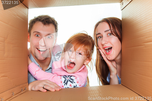 Image of Family in a cardboard box ready for moving house