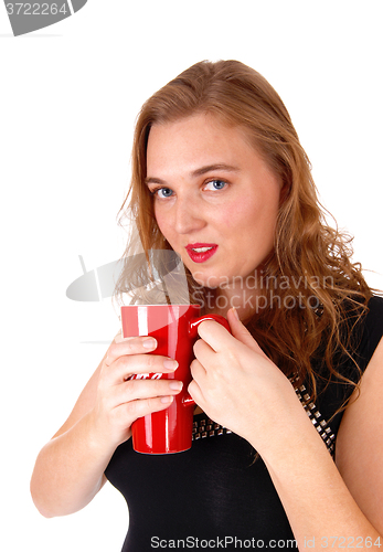 Image of Blond woman drinking coffee.