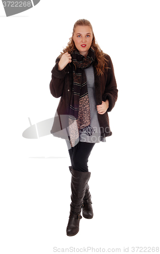 Image of Young woman in jacket and boots.